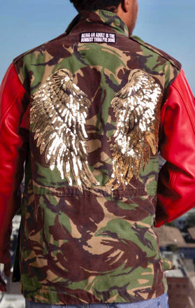 Load image into Gallery viewer, Male models back of CdJ Hides jacket with camo vest, red leather sleeves and gold angel wing embellishments.

