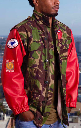 Load image into Gallery viewer, Male models front view of CdJ Hides jacket with camo vest and red leather sleeves.
