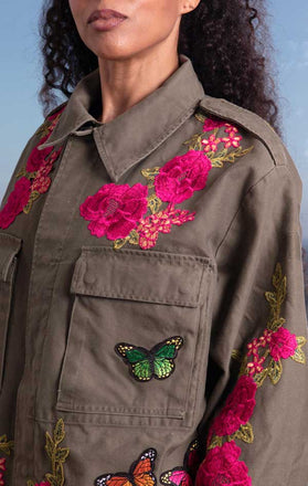 Load image into Gallery viewer, Side chest view of CdJ Flower Bomb jacket.
